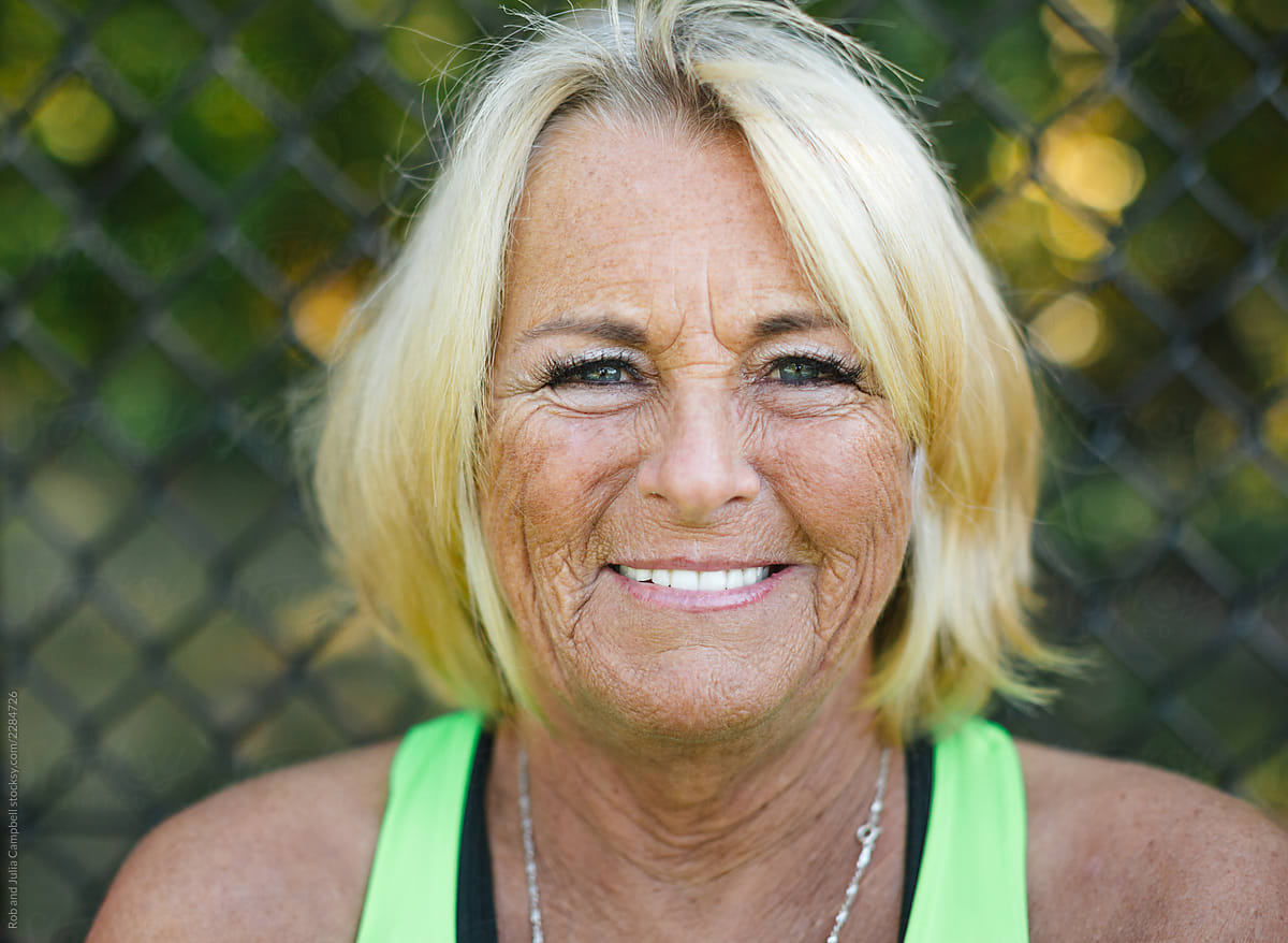 Smiling Mature Woman Wearing Tank Top By Stocksy Contributor Rob And Julia Campbell Stocksy 