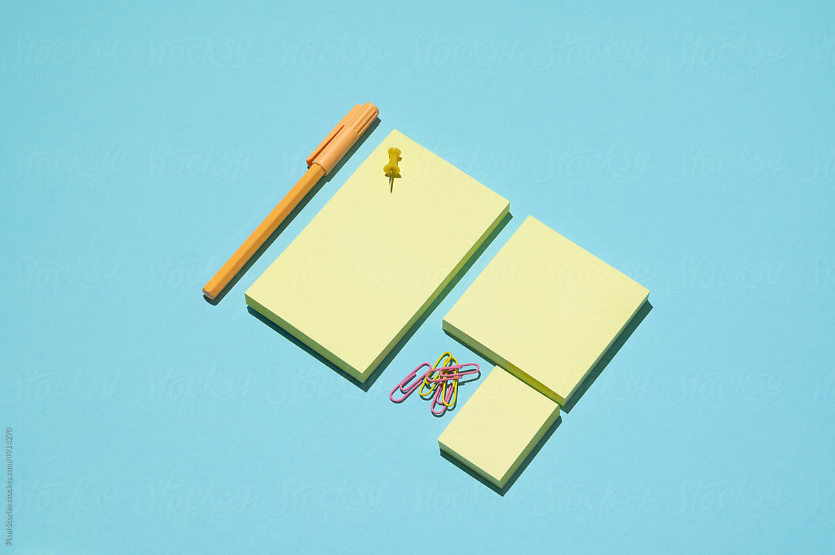 Post it notes. Office supplies - pens, pins and clips.