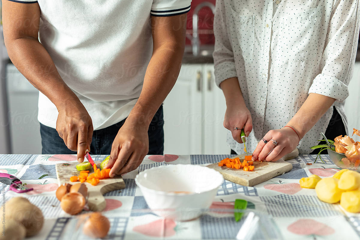 Couple Cooking Together In Kitchen By Stocksy Contributor Mihajlo
