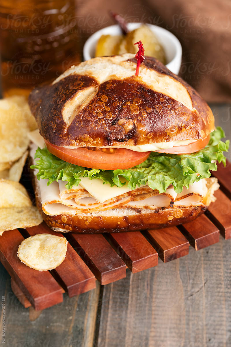 "Turkey And Swiss Sandwich On Pretzel Bun" by Stocksy Contributor "Sean ...