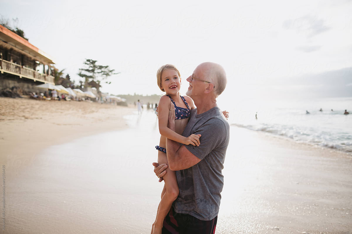 Active Happy Grandpa Having Fun With Granddaughter On Beach Vac By Rob 