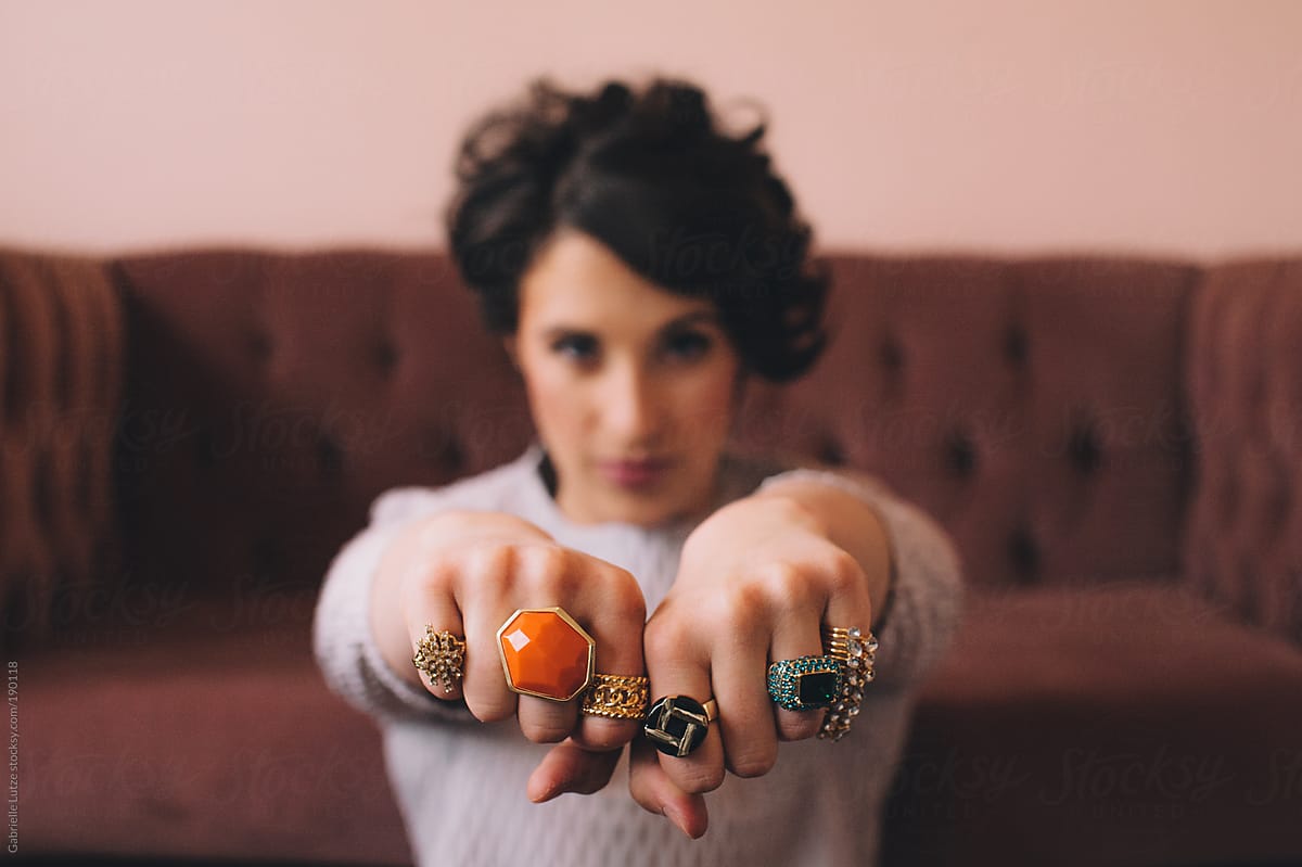 Woman Showing Off Lots of Rings