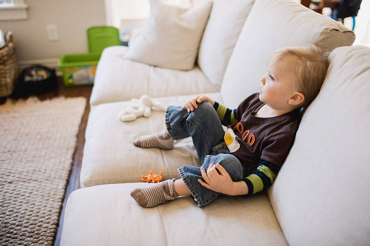 relaxed toddler watches tv