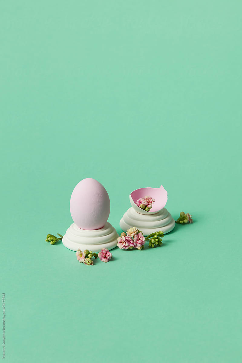 Easter eggs with blossoming flowers on egg stands