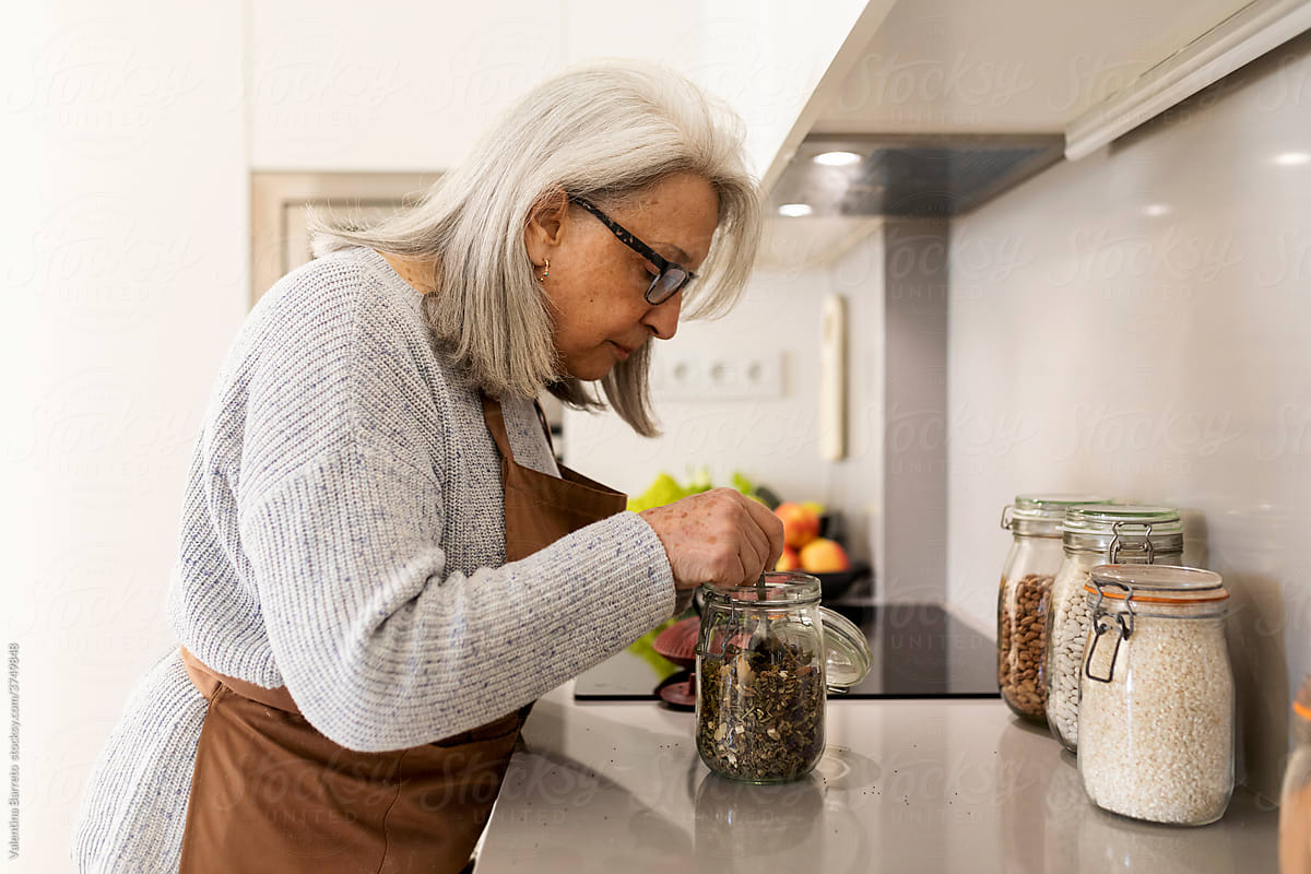 senior woman preparing tea