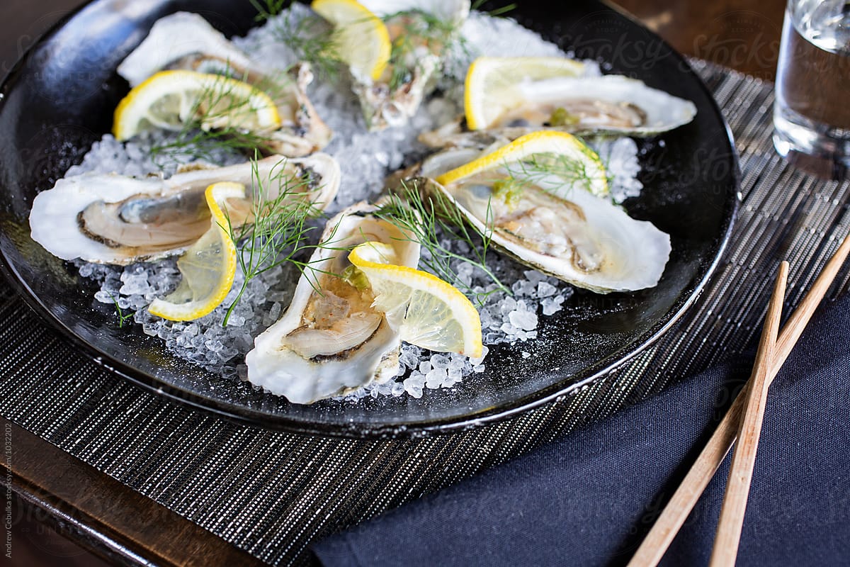 Oysters with citrus on rock salt