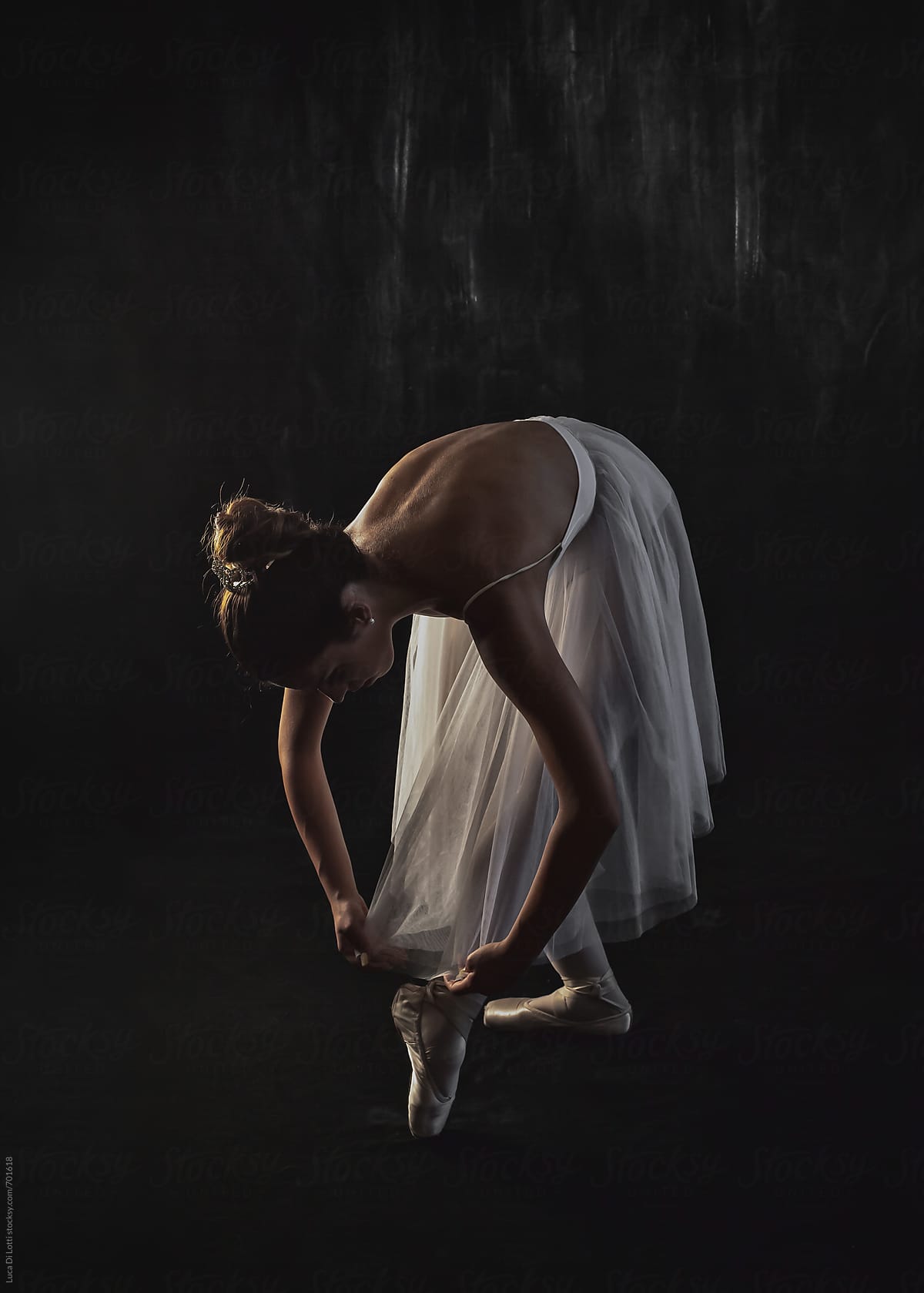 Ballerina against a dark backdrop