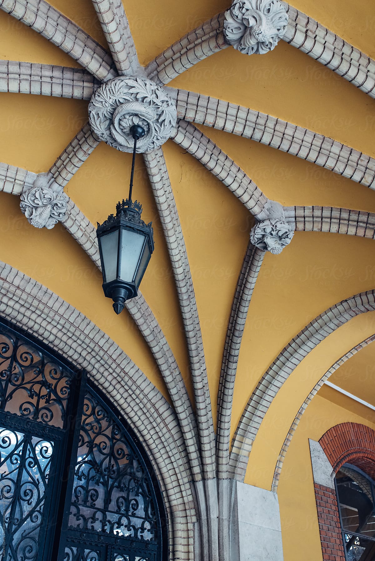 Ornated arched ceiling and light on an old European building