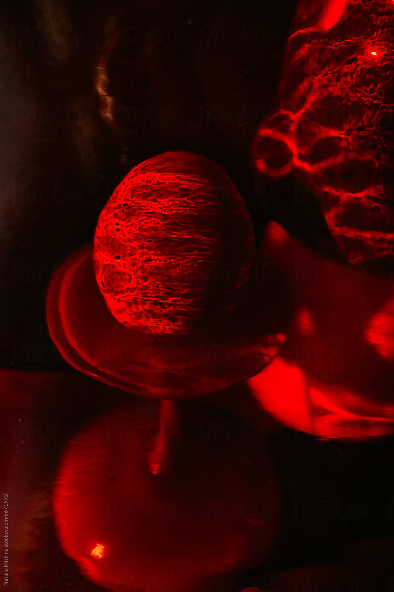 Egg through red glass.