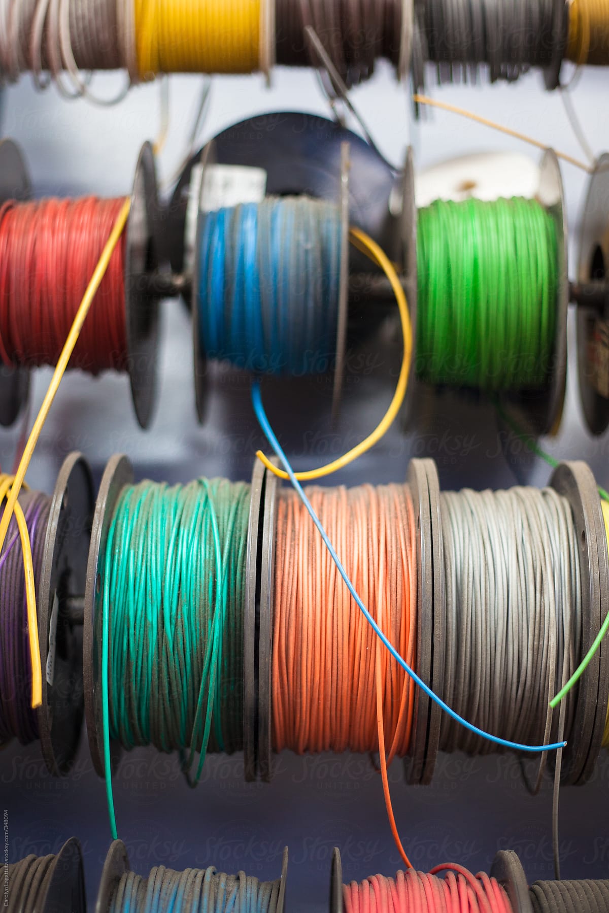 Spools of colorful electrical wire in a workshop