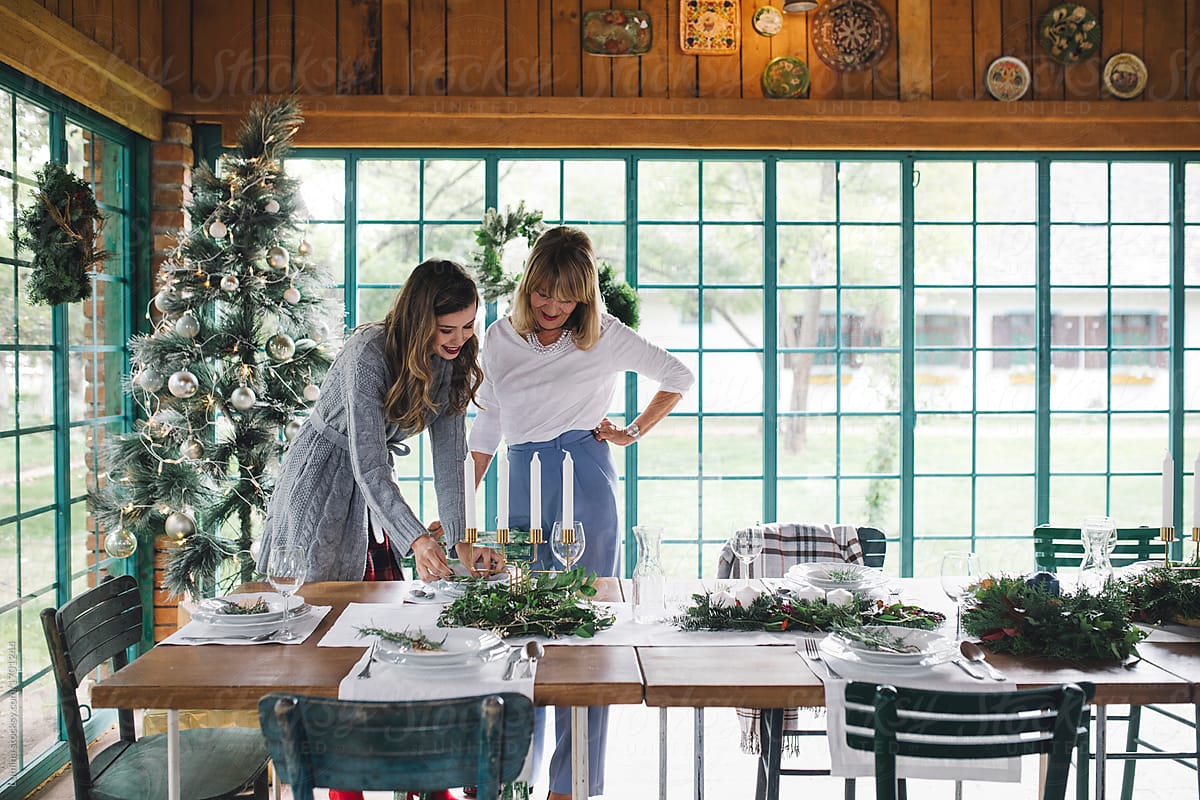 Women Decorating Dining Table for Christmas Dinner