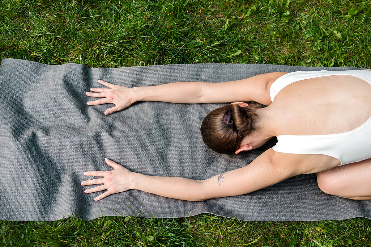 Healthy Start to the Day: Young Woman Experiencing Yoga in Green Oasis