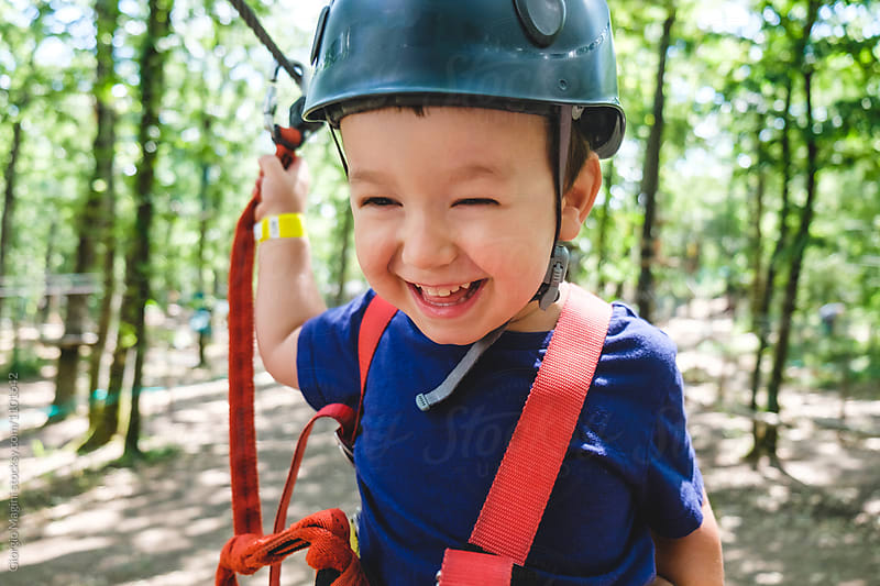 Toddler Boy with Harness and Helmet at the Adventure Park