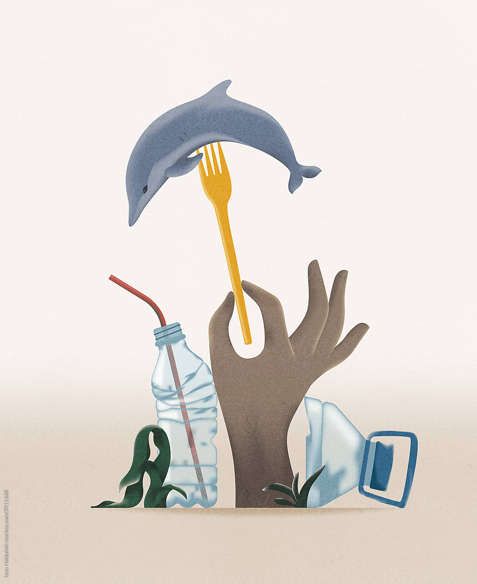 Hand holds a plastic fork with dolphin among plastic waste