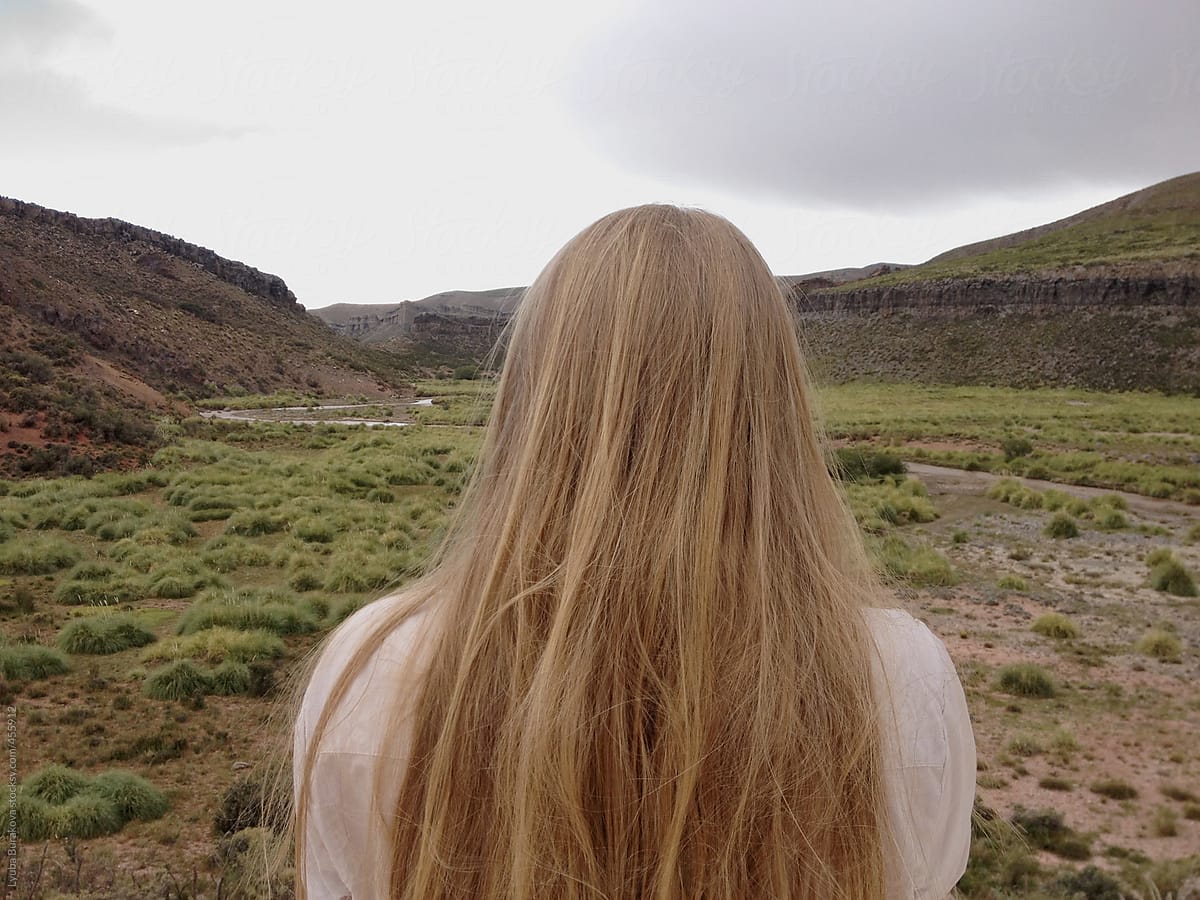 Back View Of The Woman With Long Blonde Hair In Mountains By Lyuba