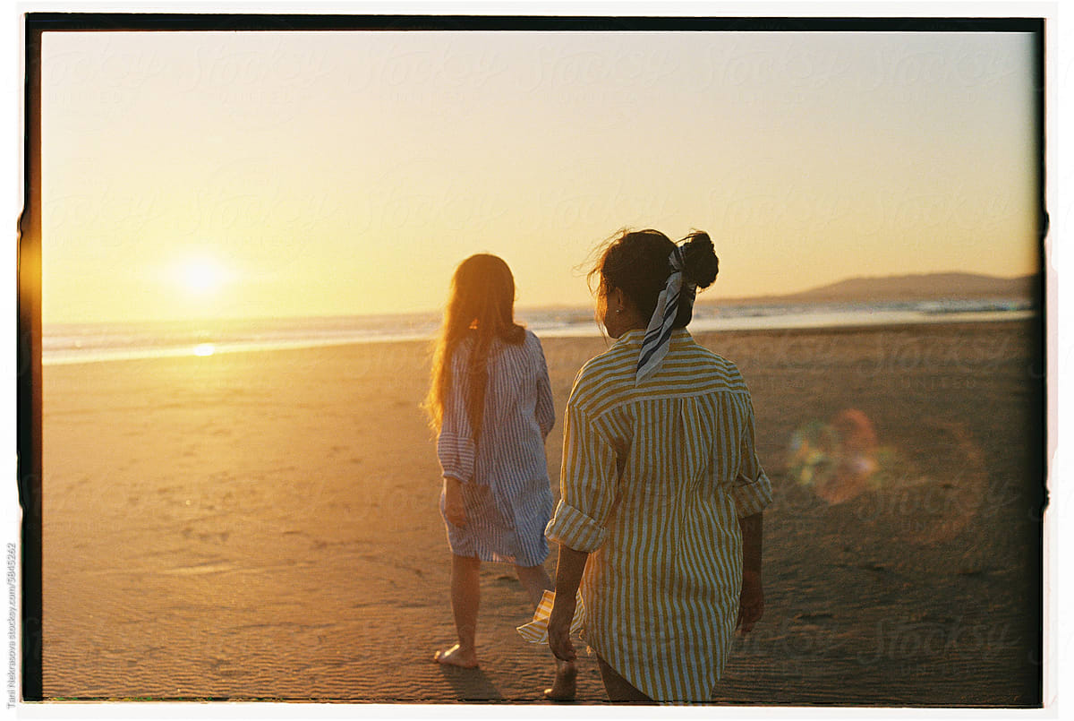 Two young female friends travel on the seaside. Friendship