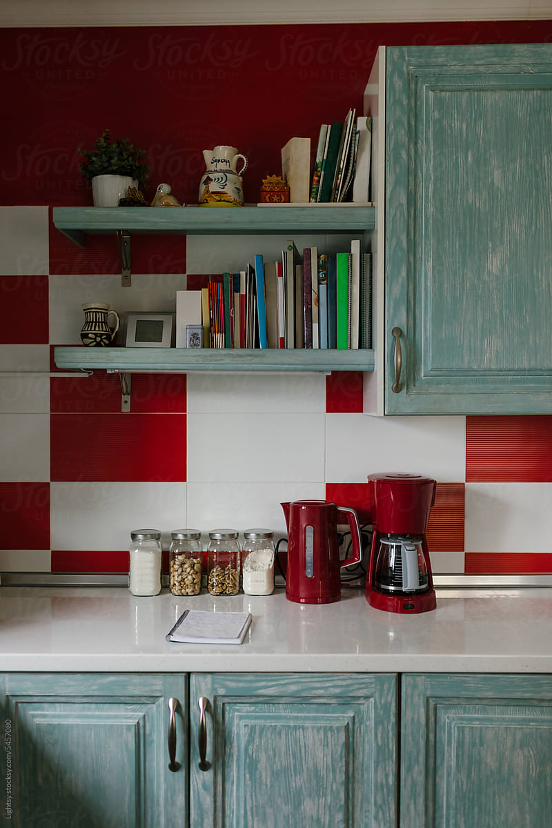 Colorful kitchen with red home appliances