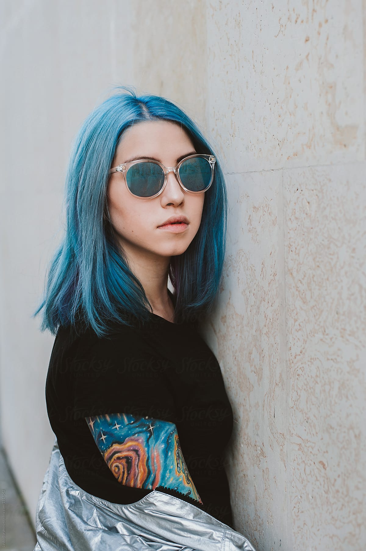 Girl With Bright Blue Hair And Tattoo Standing Against The Wall By Lyuba Burakova Hairstyle Sunglasses Stocksy United