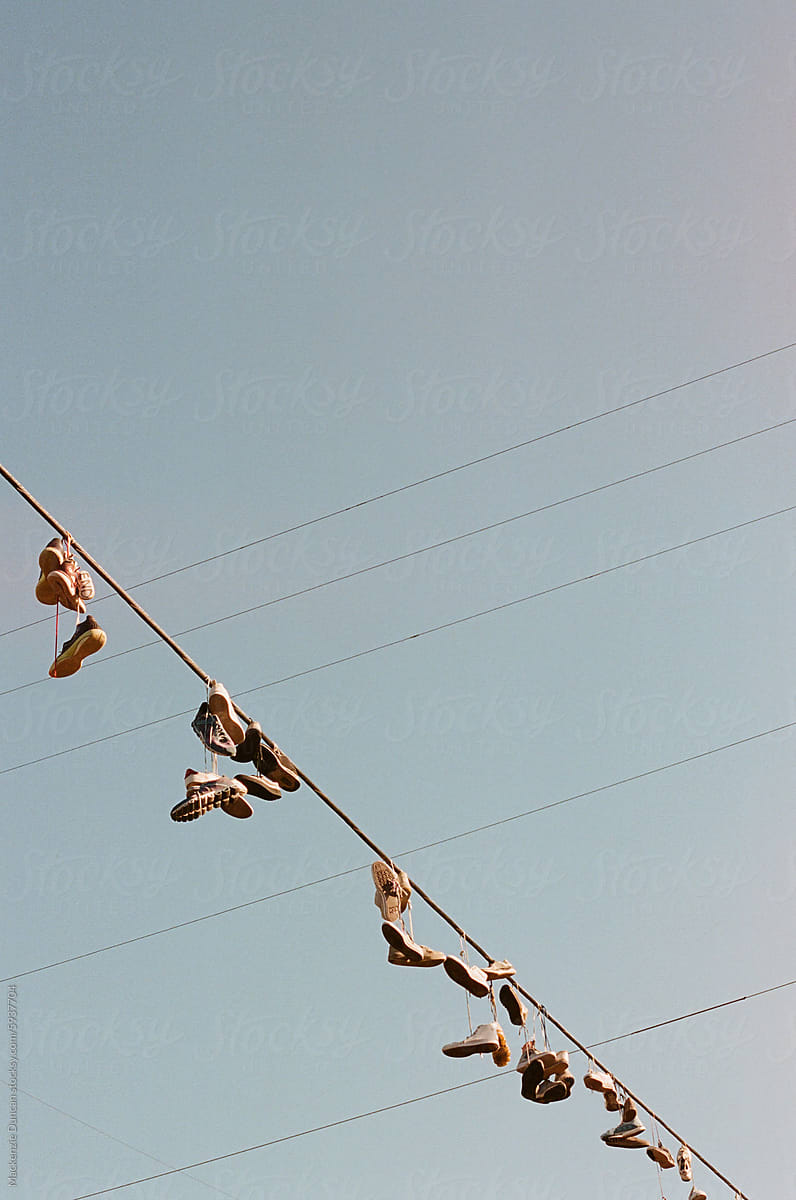 Shoes hanging on telephone cables