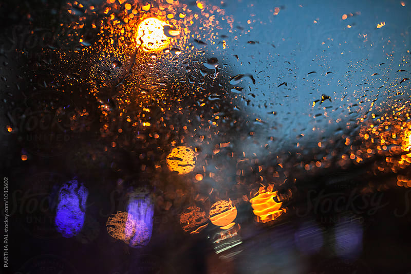 obscure street lights through wind screen in rain