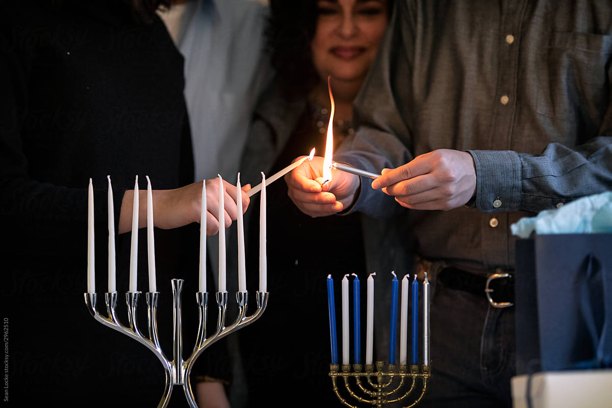 Hanukkah: Children Lighting Two Menorahs