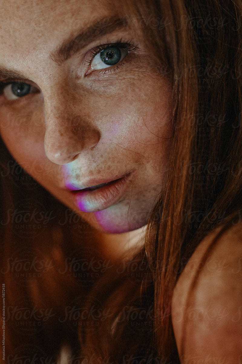 Close Up woman\'s portrait of Ginger female with many freckles on face