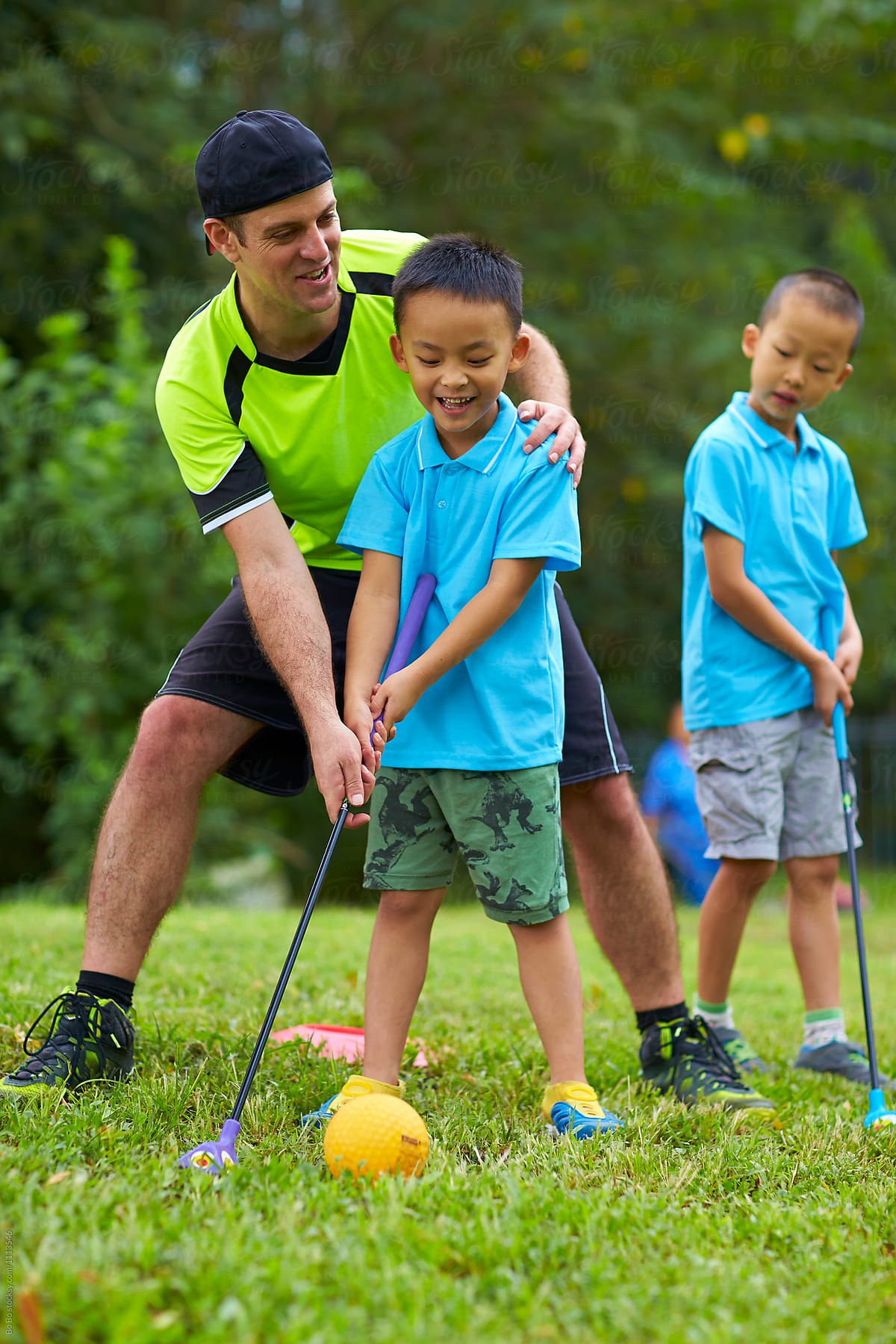 Happy Asian Kids Playing Outdoor In The Park by Stocksy Contributor Bo  Bo - Stocksy