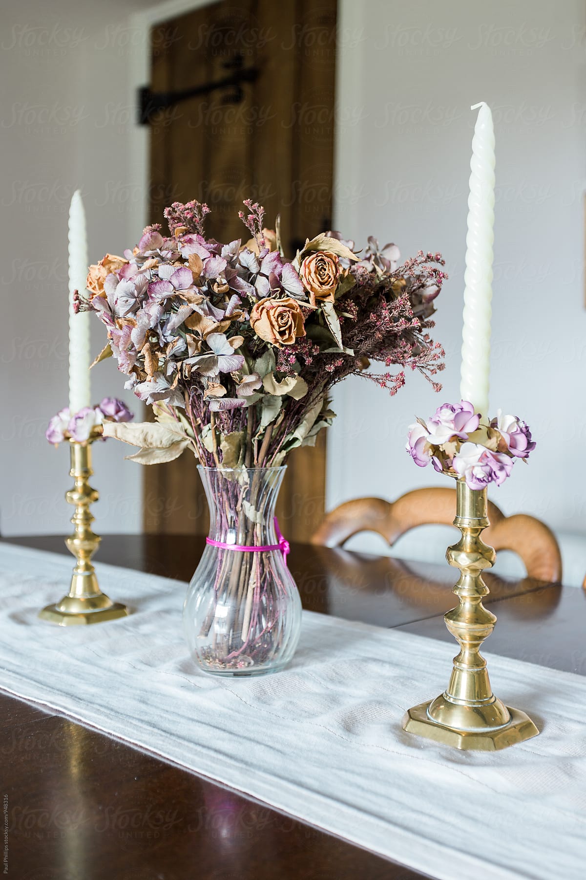 Dried flower display on a antique table setting.