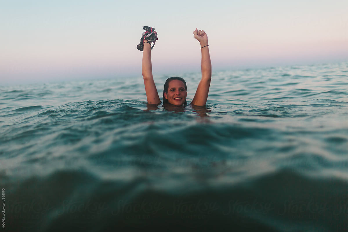 Young Woman Swims Naked In The Ocean Surf Del Colaborador De Stocksy Howl Stocksy