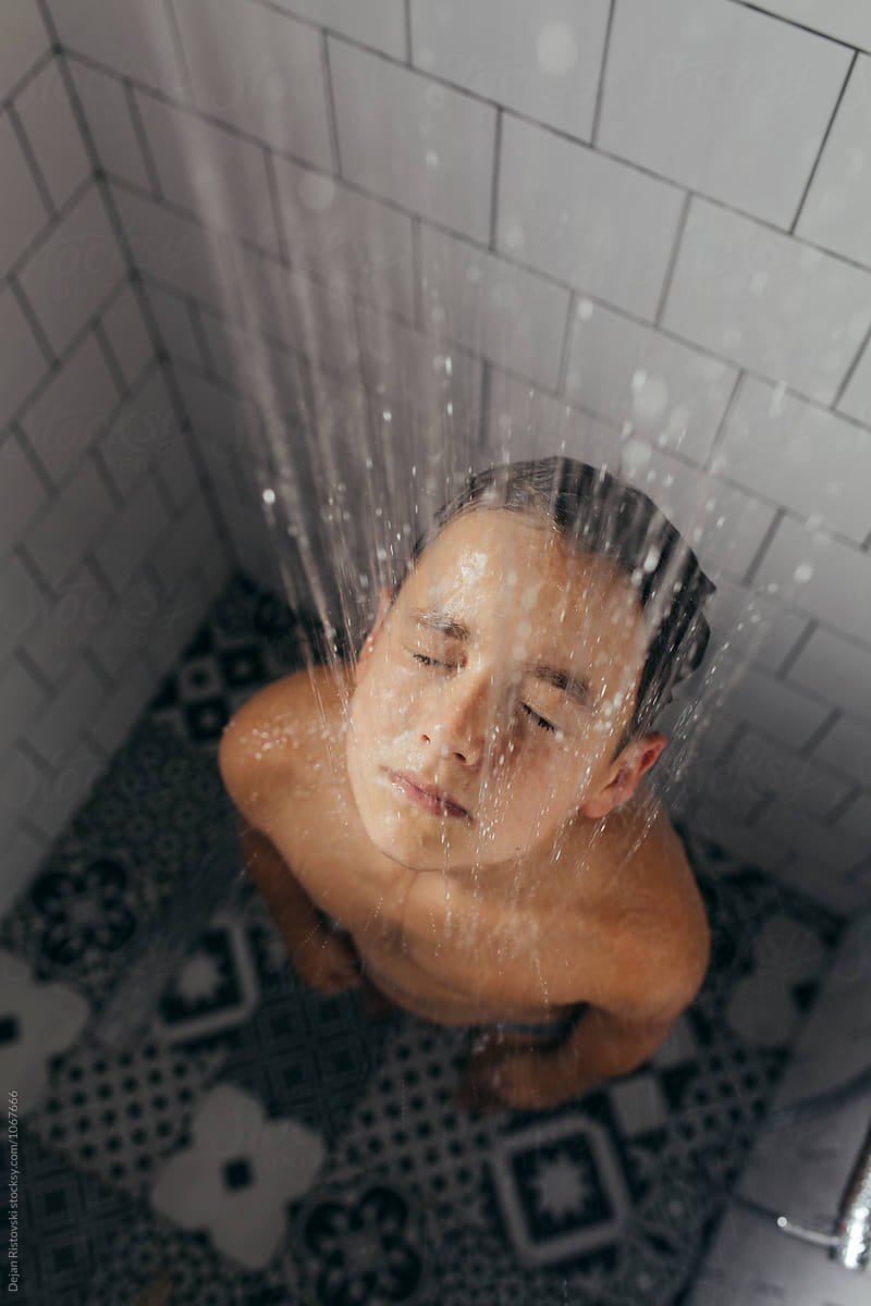 Boy Under Shower Taking A Bath B