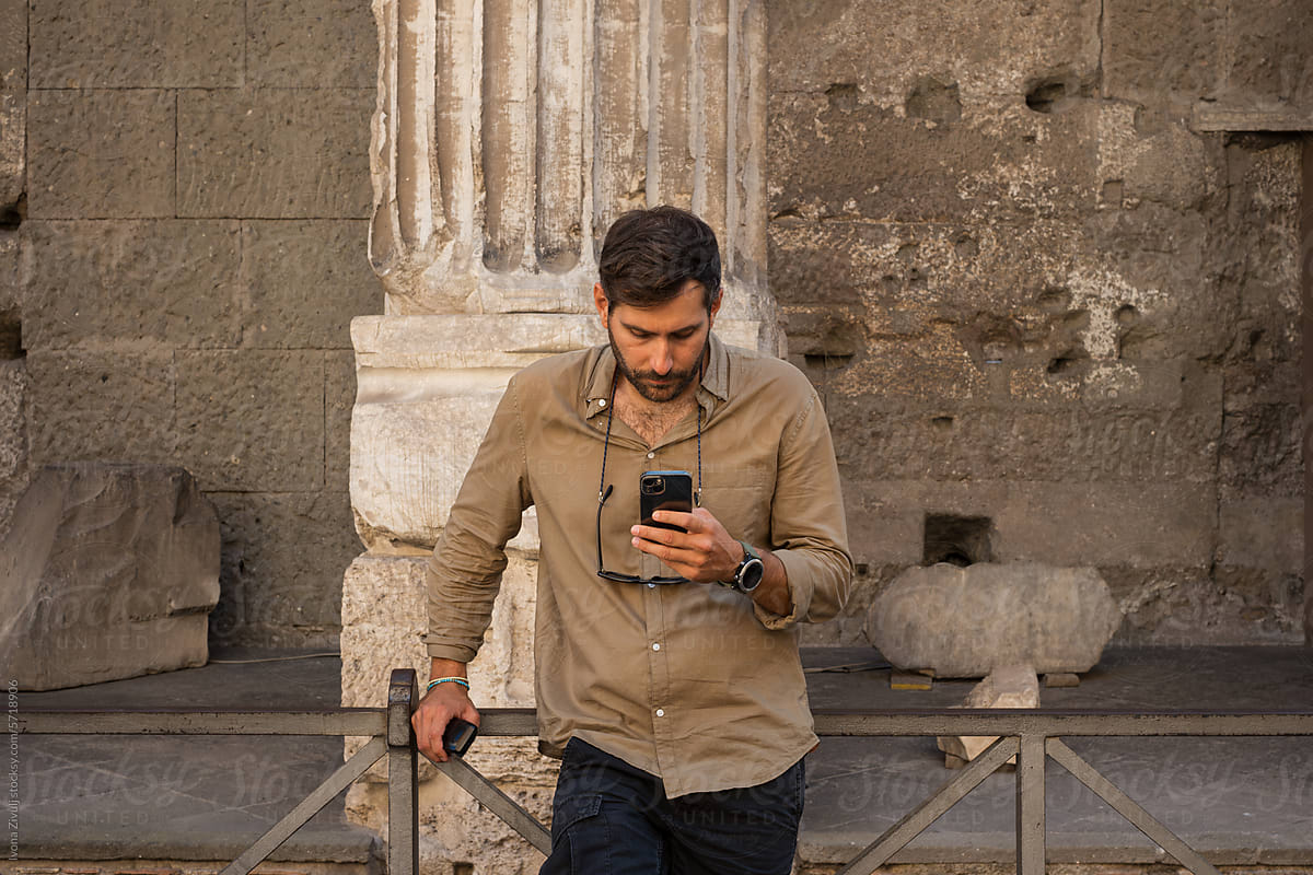 Handsome Young Man Using Mobile Phone in Rome