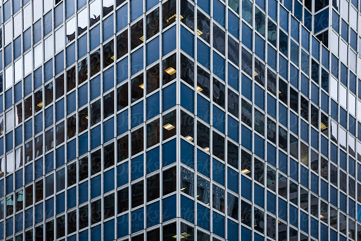 the corner of a building with black and blue patterns