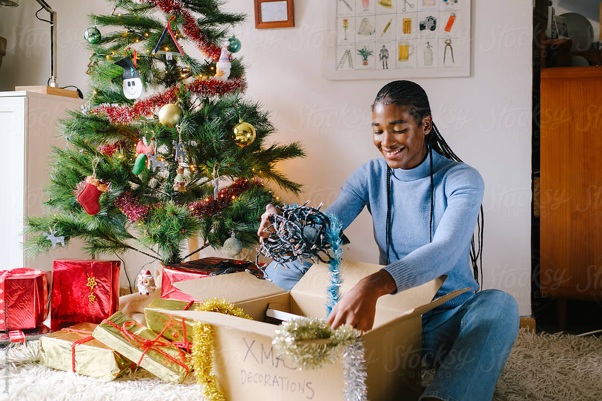 Woman at home preparing Christmas decorations at home