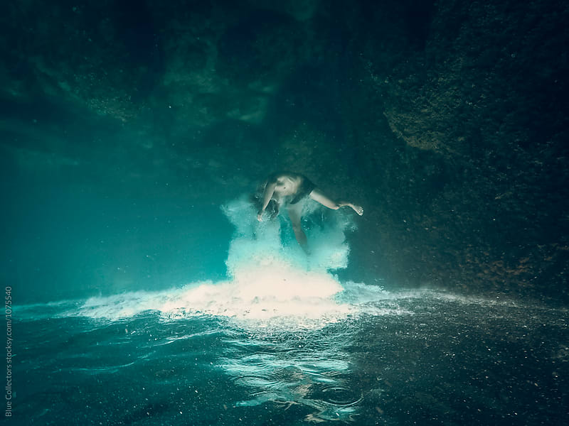 Young man falling into the deep water