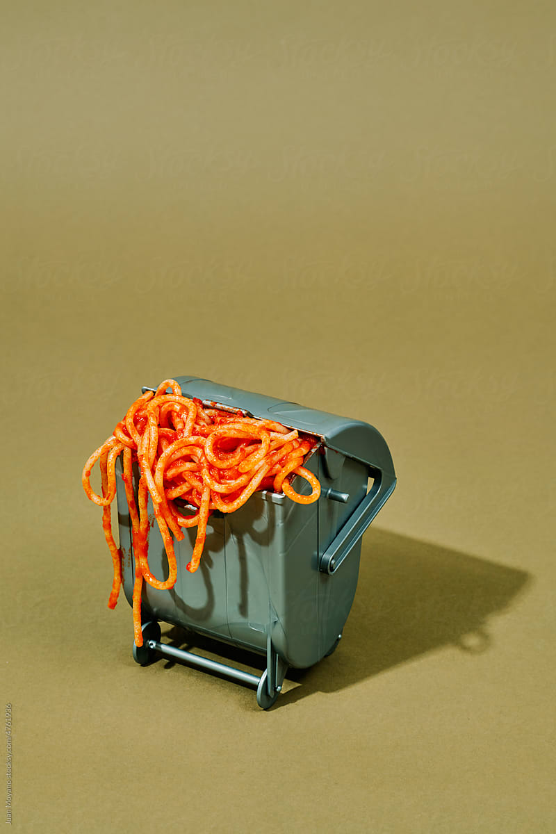 spaghetti in a waste container