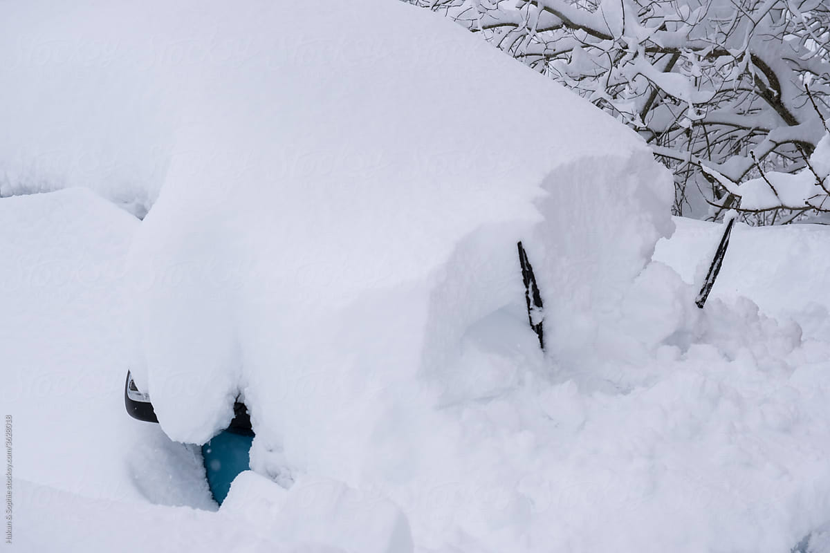 car under deep snow