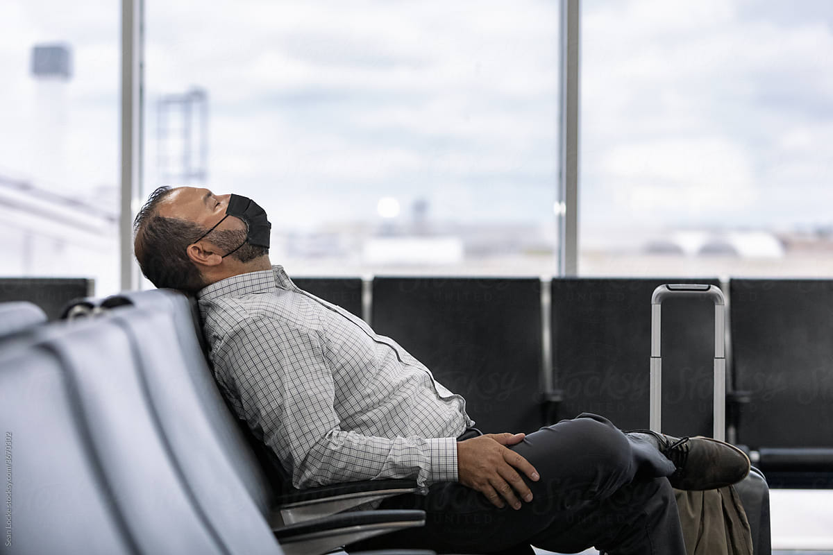 Travel: Tired Traveler Takes Nap Before Flight
