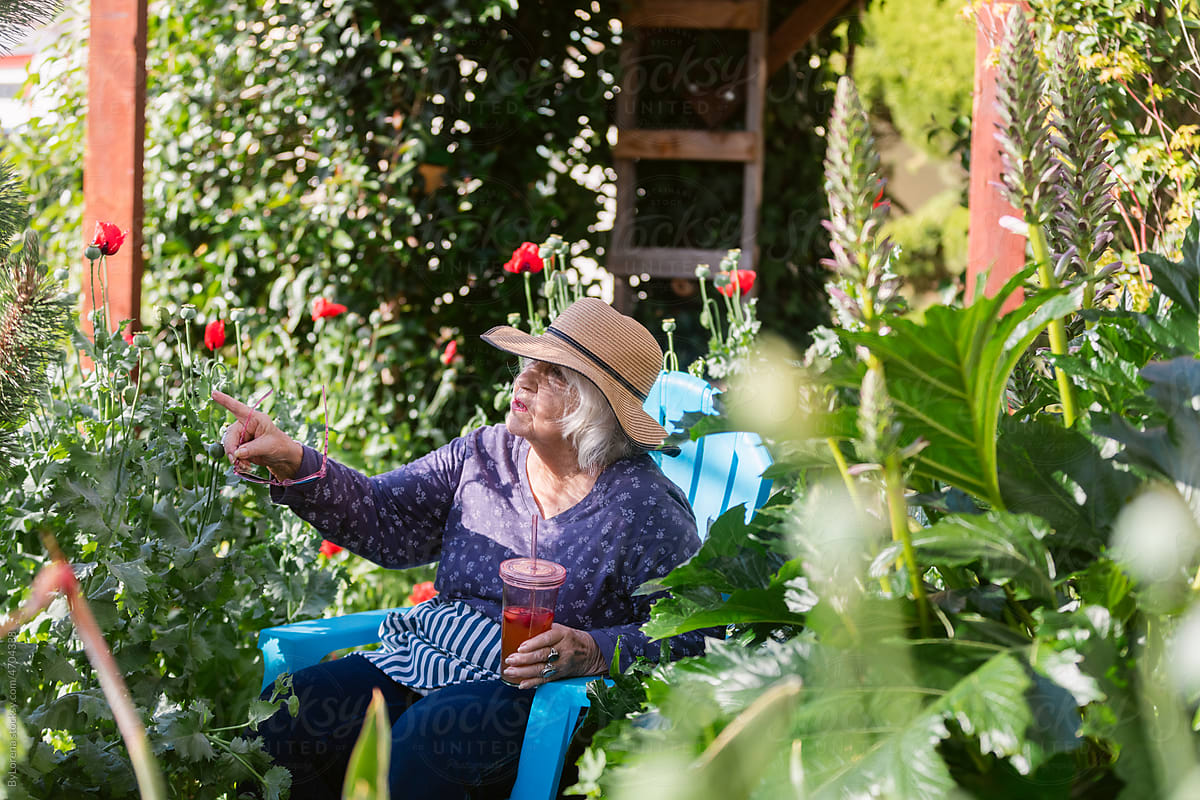 Senior lady with lemonade at garden