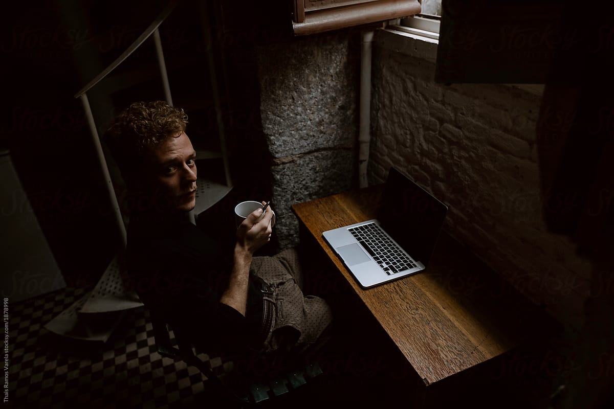 writer working at home on his laptop
