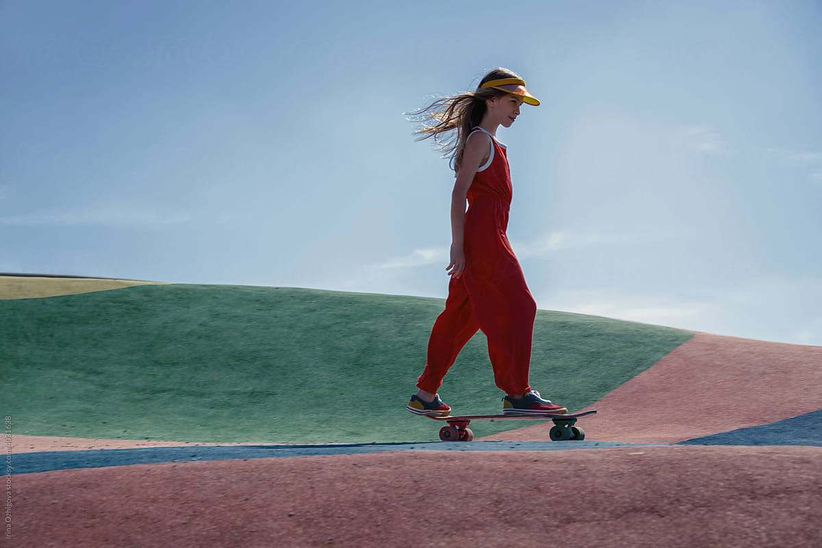 Girl riding skateboard in colorful park