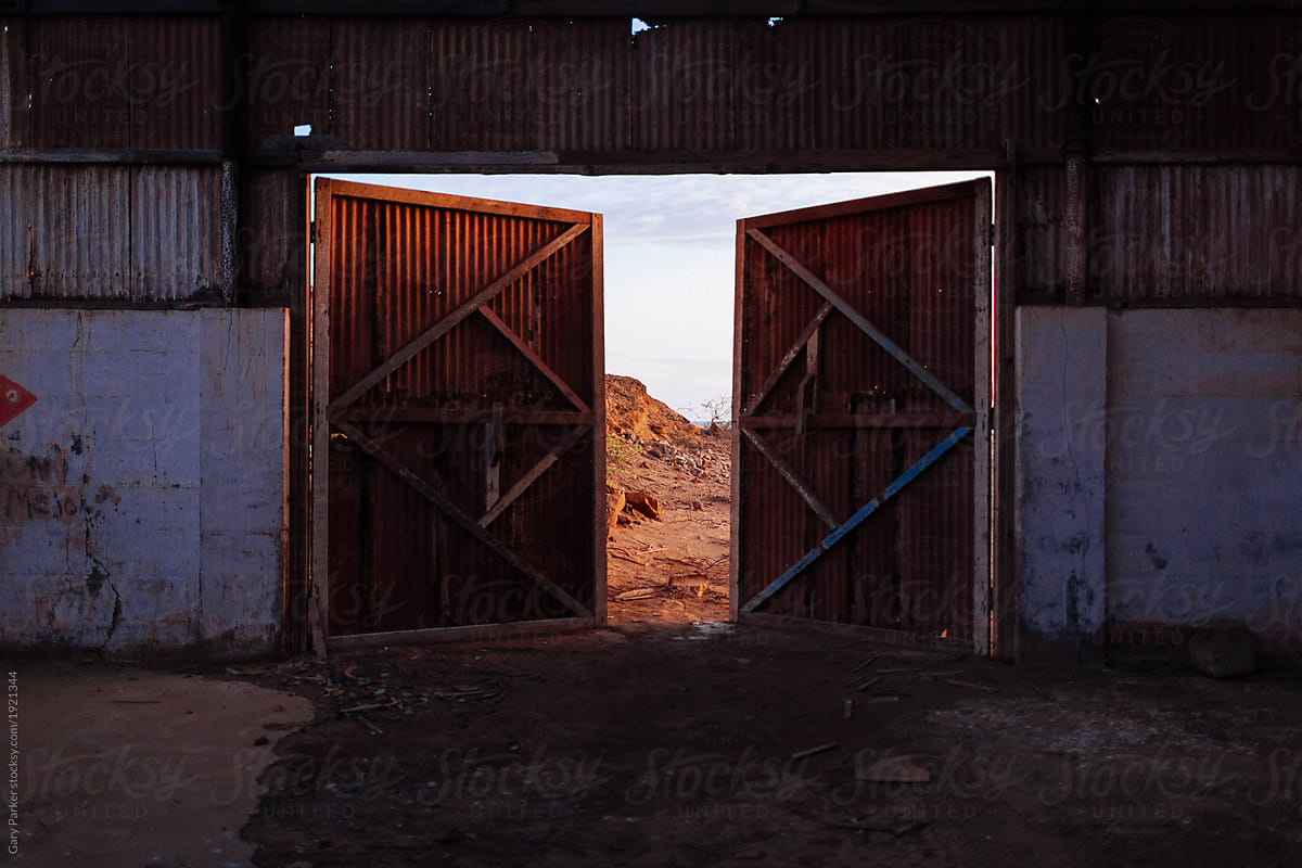 Abandoned factory doors to the desert