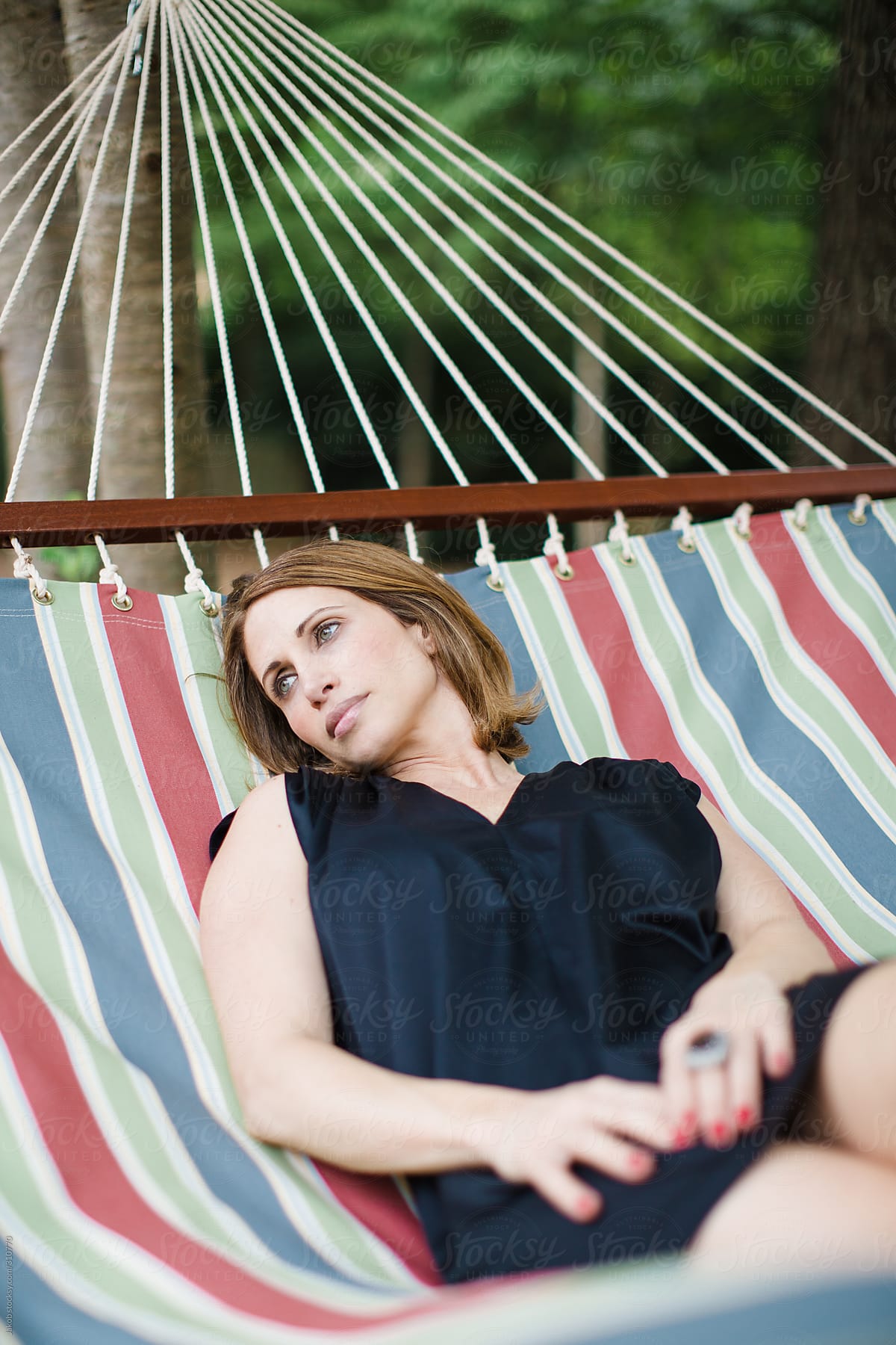 Beautiful Woman Relaxing In A Hammock Del Colaborador De Stocksy Jakob Lagerstedt Stocksy