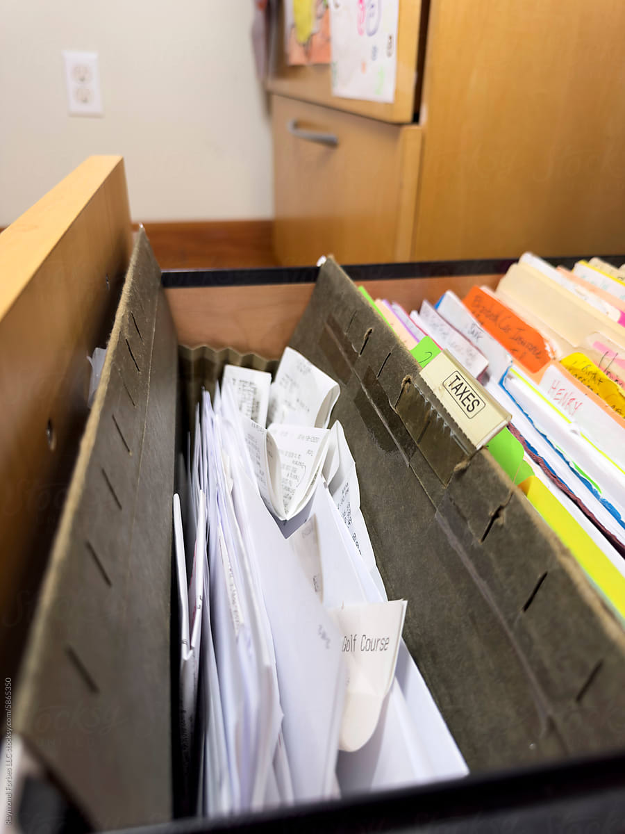 Receipts in in file folder in file cabinet drawer  in home office