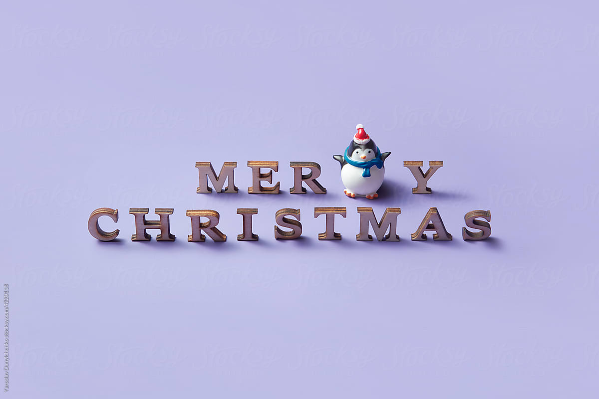 Toy penguin with merry christmas message