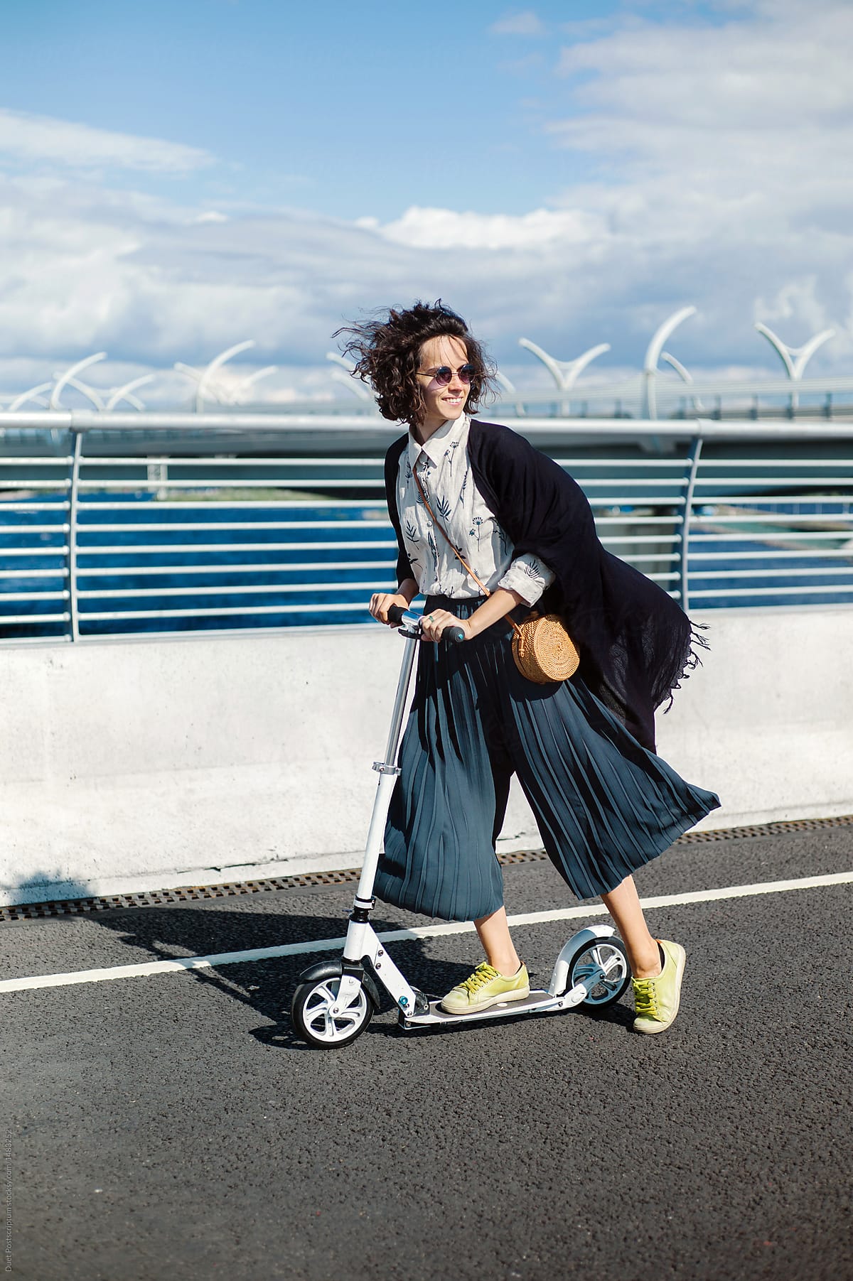 Woman posing with scooter
