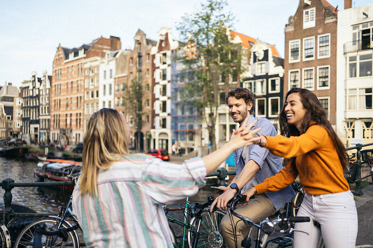 Group of friends meeting in Amsterdam with the bikes