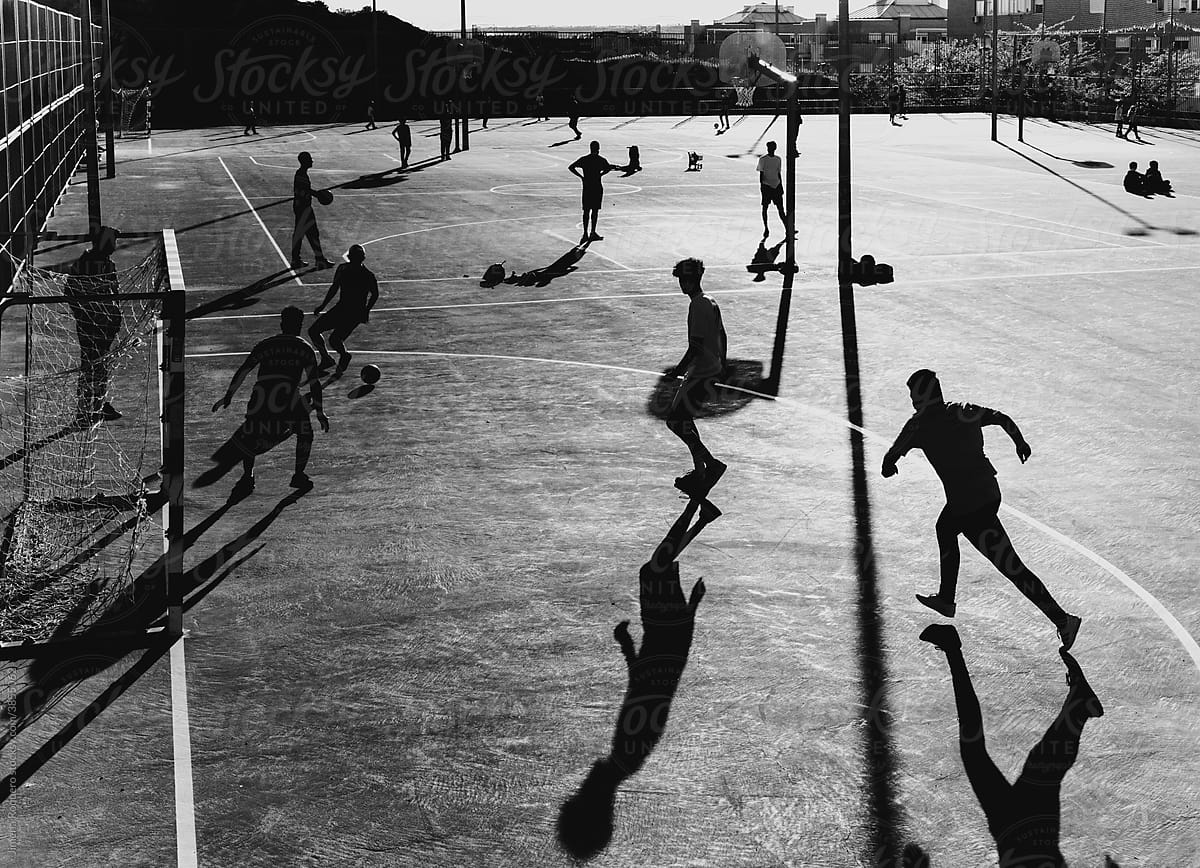 Silhouettes playing soccer