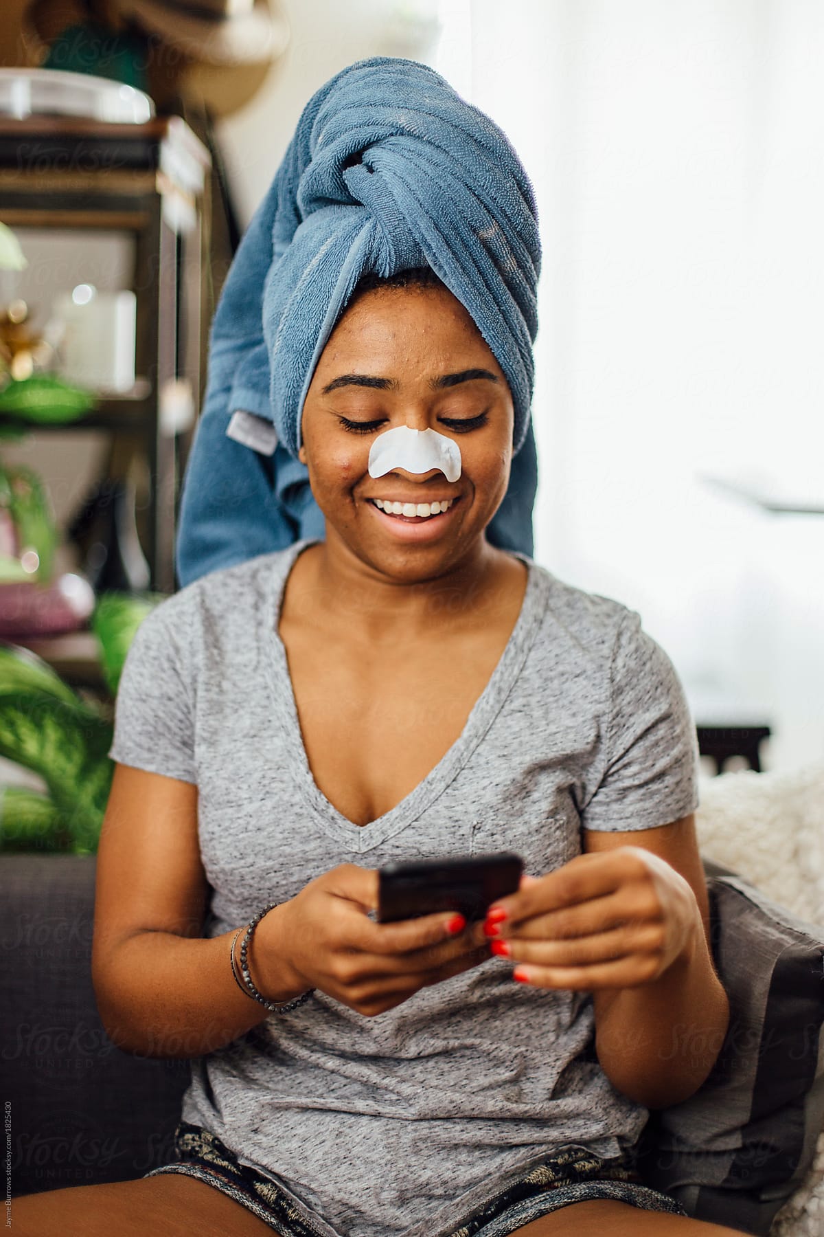 Black Woman At Home Wearing A Nose Strip By Stocksy Contributor