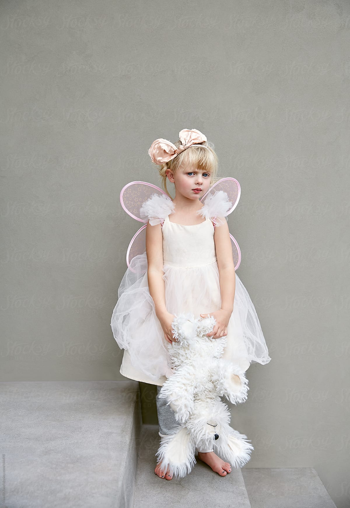 Portrait of adorable little girl in angel costume