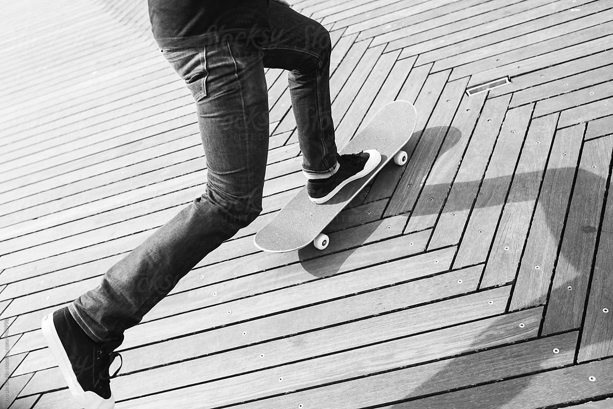 Close up of a skater riding, feet and skateboard